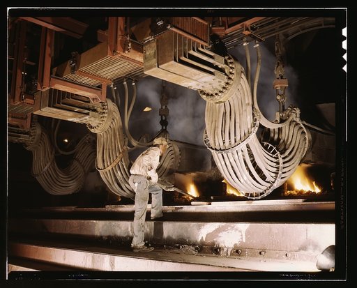 Large electric phosphate smelting furnace used in the making of elemental phosphorus in a TVA chemical plant in the Muscle Shoals area, Alabama