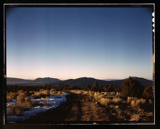 Vista westward over the Rio Grande valley from the foothills of the Sangre de Cristos [Mountains] near Questa, Taos County, N[ew] M[exico