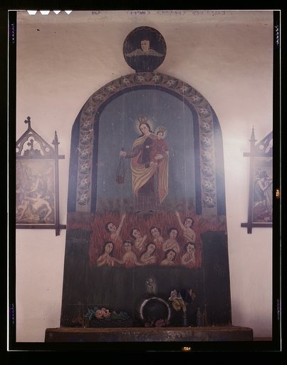 The altar of Nuestra Senora del Carmel on the south wall of the church, Trampas, N.M.