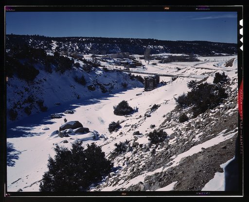 Trampas, Taos County, New Mexico, a Spanish-American village in the foothills of the Sangre de Cristo Mountains dating back to 1700 which was once a sheep raising center. Due to overgrazing and loss of range title, its inhabitants now work as migratory labor and at subsistence farming