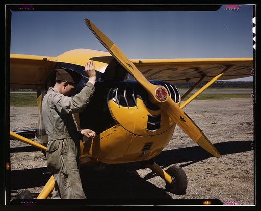 Civil Air Patrol Base, Bar Harbor, Maine. Ground crew making a routine overhaul of a patrol plane, Coastal Patrol #20