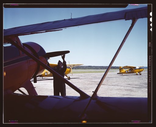 Civil Air Patrol Base, Bar Harbor, Maine. Ground crew making overhaul of a patrol plane. Coastal Patrol #20