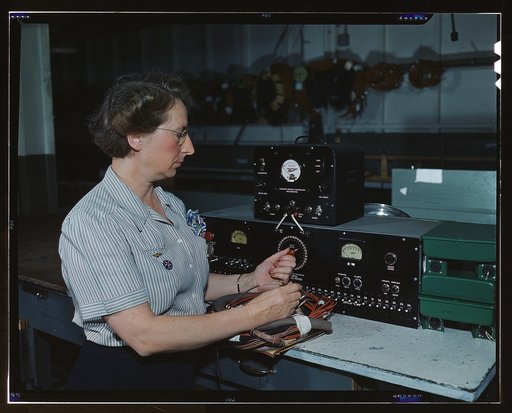 Working with the electric wiring at Douglas Aircraft Company, Long Beach, Calif.