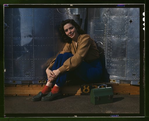 A noontime rest for a full-fledged assembly worker at the Long Beach, Calif., plant of Douglas Aircraft Company. Nacelle parts for a heavy bomber form the background
