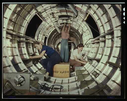 Women workers install fixtures and assemblies to a tail fuselage section of a B-17 bomber at the Douglas Aircraft Company plant, Long Beach, Calif. Better known as the "Flying Fortress," the B-17F is a later model of the B-17, which distinguished itself in action in the south Pacific, Germany and el