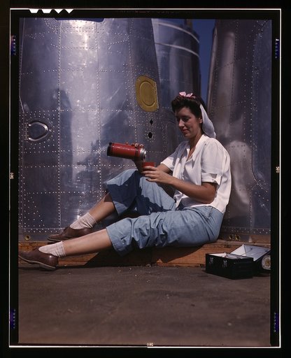 Girl worker at lunch also absorbing California sunshine, Douglas Aircraft Company, Long Beach, Calif.