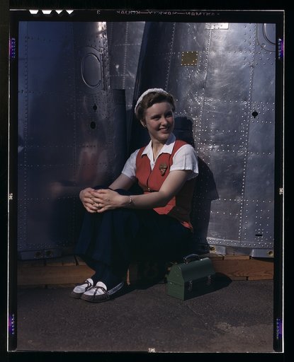 A noontime rest for a full-fledged assembly worker at the Long Beach, Calif., plant of Douglas Aircraft Company. Nacelle parts for a heavy bomber form the background