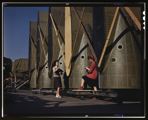Carefully trained women inspectors check and inspect cargo transport innerwings before they are assembled on the fuselage, Douglas Aircraft Company, Long Beach, Calif.