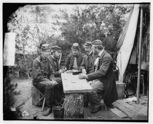 Yorktown, Va., vicinity. Duc de Chartres, Comte de Paris, Prince de Joinville, and friends playing dominoes at a mess table, Camp Winfield Scott