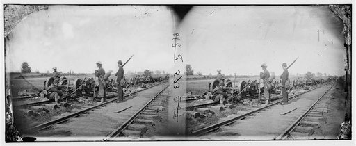 Manassas Junction, Va. Soldiers beside damaged rolling stock of the Orange & Alexandria Railroad