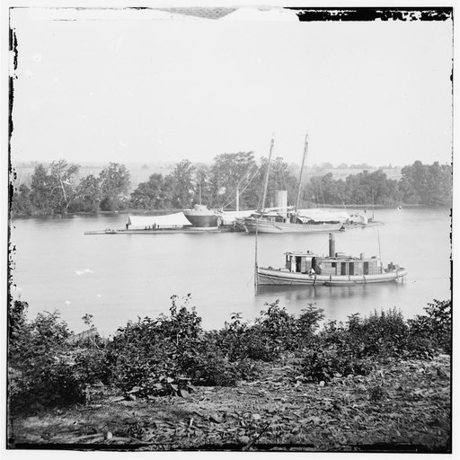 James River, Va. U.S.S. monitor Canonicus taking on coal from a schooner