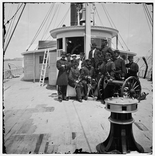 Unknown location. Officers of the U.S.S. Philadelphia before pilot-house