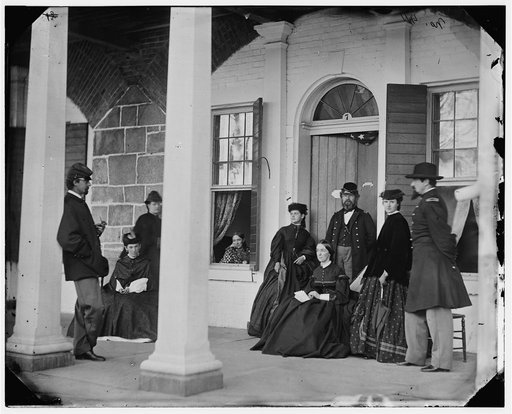 Fort Monroe, Va. Officers and ladies on porch of a garrison house