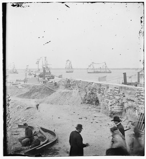 Charleston, S.C. Federal squadron dressed with flags for the anniversary of Maj. Robert Anderson's surrender (1861) seen from a parapet of Fort Sumter