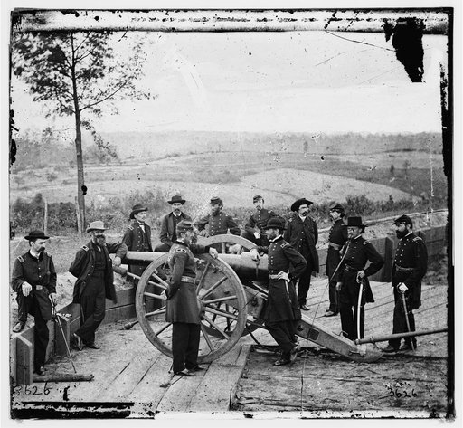 Atlanta, Ga. Gen. William T. Sherman, leaning on breach of gun, and staff at Federal Fort No. 7