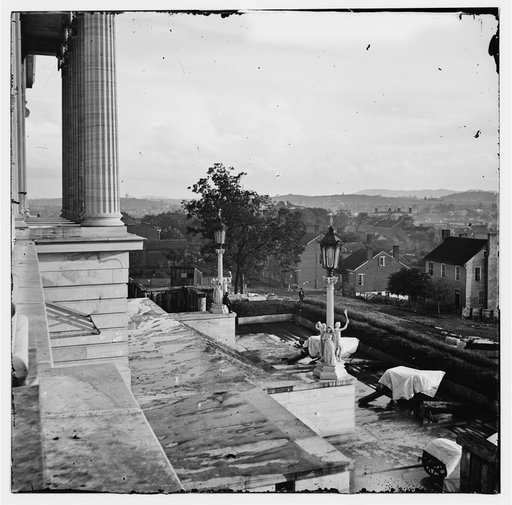 Nashville, Tenn. Steps of the Capitol with covered guns; vista of the city beyond
