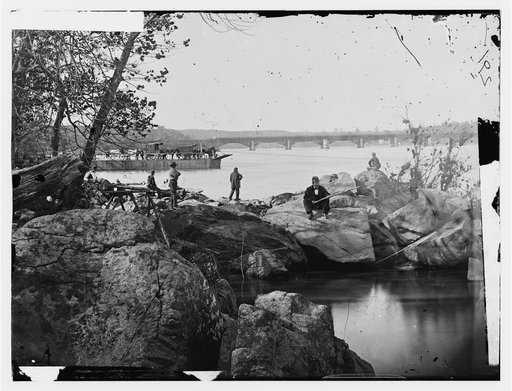 Washington, D.C. Georgetown ferry-boat carrying wagons, and Aqueduct Bridge beyond, from rocks on Mason's Island