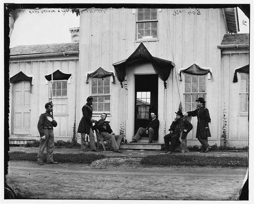 Arlington, Va. Capt. Nevins and officers in front of headquarters, Fort Whipple; mourning crepe drawn over doors and windows