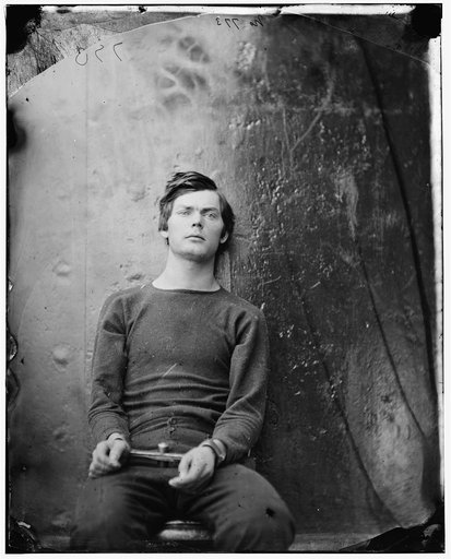 Washington Navy Yard, D.C. Lewis Payne, in sweater, seated and manacled
