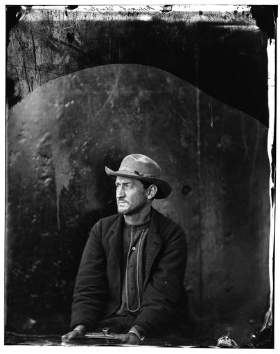 Washington Navy Yard, D.C. Edman Spangler, a "conspirator," in hat and manacled