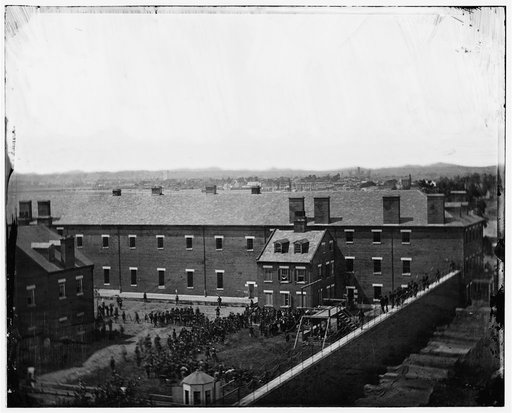 Washington, D.C. Execution of the conspirators: scaffold in use and crowd in the yard, seen from the roof of the Arsenal