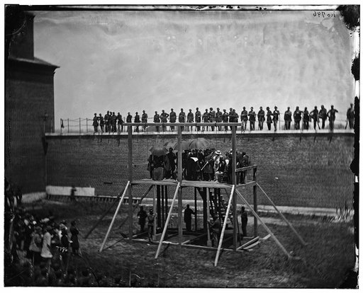 Washington, D.C. Gen. John F. Hartranft reading the death warrant to the conspirators on the scaffold