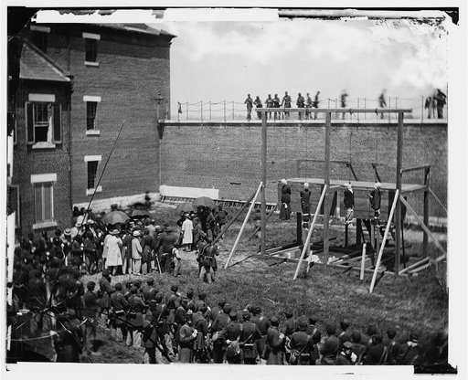 Washington, D.C. Hanging hooded bodies of the four conspirators; crowd departing