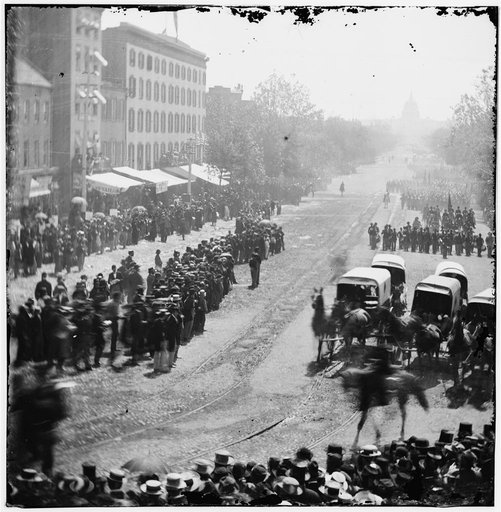 Washington, D.C. Group of ambulances followed by band and infantry units on Pennsylvania Avenue near the Treasury