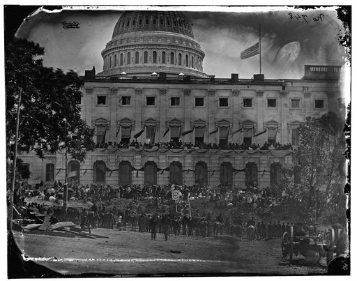 Washington, D.C. Spectators at side of the Capitol, which is hung with crepe and has flag at half-mast