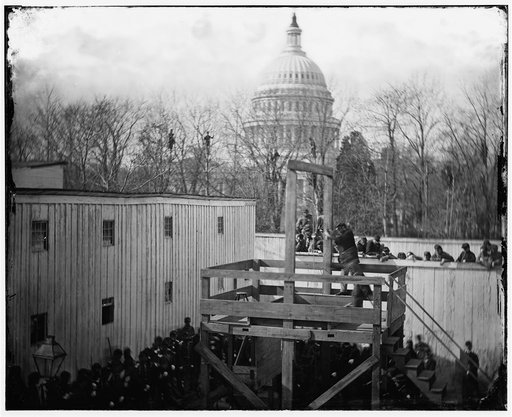 Washington, D.C. Soldier springing the trap; men in trees and Capitol dome beyond