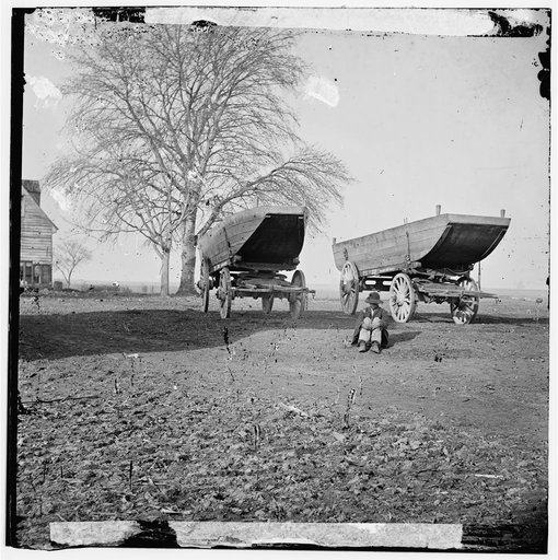 Dutch Gap, Virginia (vicinity). Pontoon boats on wheeled carriages at deserted farm house near Dutch Gap canal