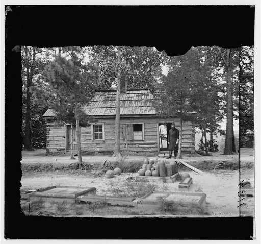 Drewry's Bluff, Virginia. Chaplains quarters. 1st Conn. Heavy Artillery in Confederate Fort Darling. Part of shot and shell in foreground was fired by U.S. Gunboats in attack on fort in 1862