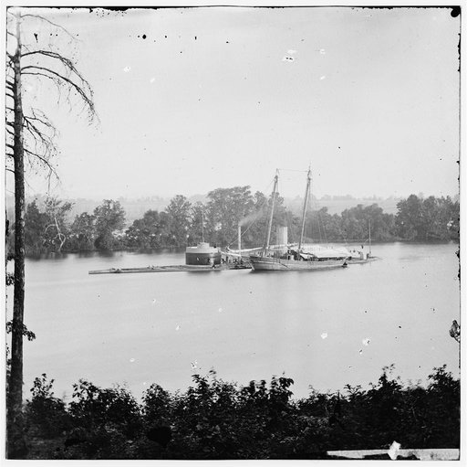 James River, Virginia. U.S. monitor CANONICUS taking on coal from a schooner