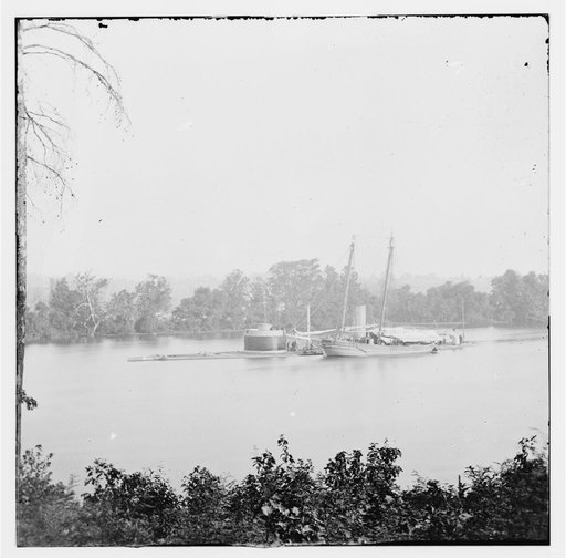 James River, Virginia. U.S.S. monitor CANONICUS taking coal from a schooner