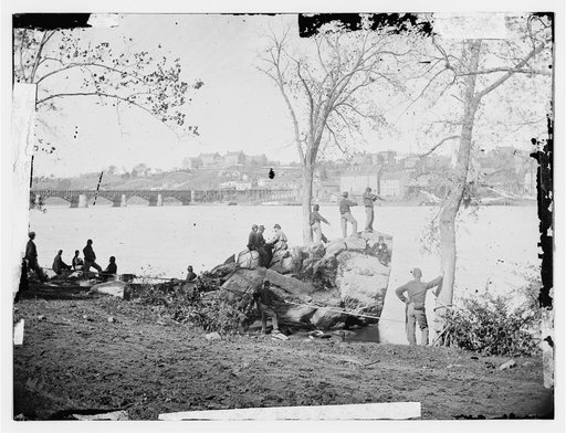 Arlington, Virginia. Georgetown aqueduct from Virginia side of Potomac with Georgetown University in background