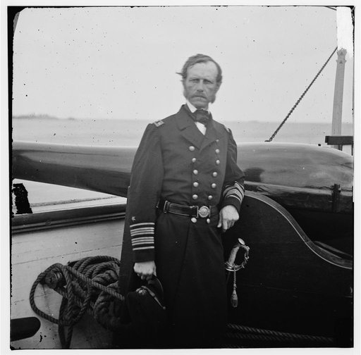 Charleston Harbor, South Carolina. Rear Adm. John A. Dahlgren standing by a Dahlgren gun on deck of U.S.S. PAWNEE