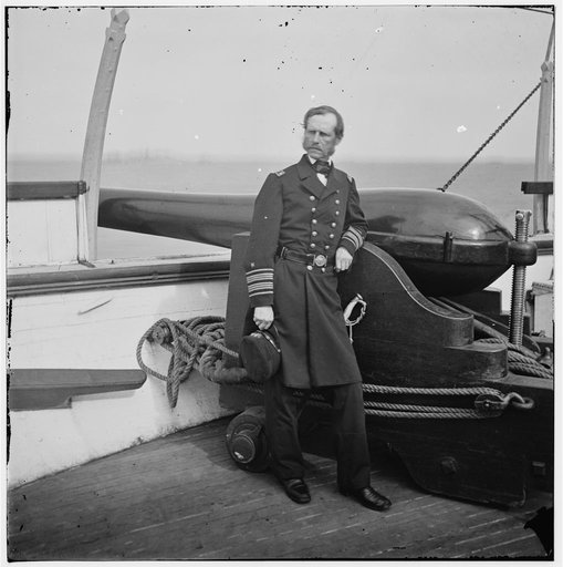 Charleston Harbor, South Carolina. Rear Adm. John A. Dahlgren standing by a Dahlgren gun on deck of U.S.S. PAWNEE