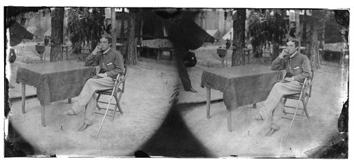 Petersburg, Virginia]. Soldier seated at table
