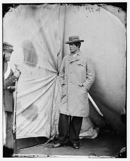 Washington Navy Yard, District of Columbia. Lewis Payne, the conspirator who attacked Secretary Seward, standing in overcoat and hat