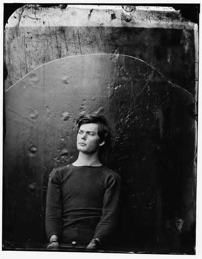 Washington Navy Yard, District of Columbia. Lewis Payne in sweater, seated and manacled