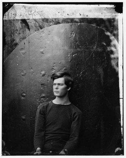 Washington Navy Yard, District of Columbia. Lewis Payne in sweater, seated and manacled