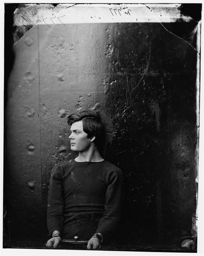 Washington Navy Yard, District of Columbia. Lewis Payne in sweater seated and manacled