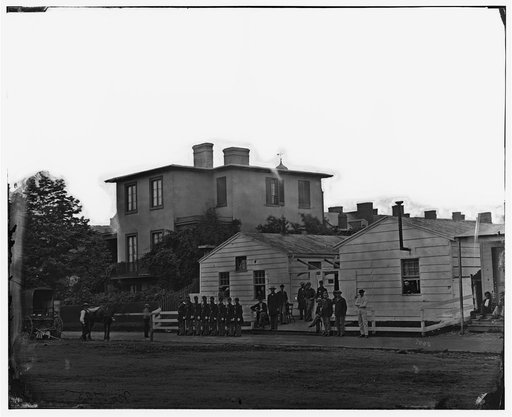 Washington, District of Columbia]. Eight soldiers in formation in front of temporary buildings
