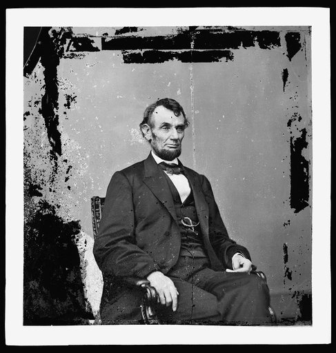 Abraham Lincoln, President of the United States, three-quarter length portrait, seated, facing right