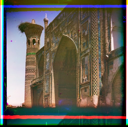 Arched entranceway to a mosque with minaret