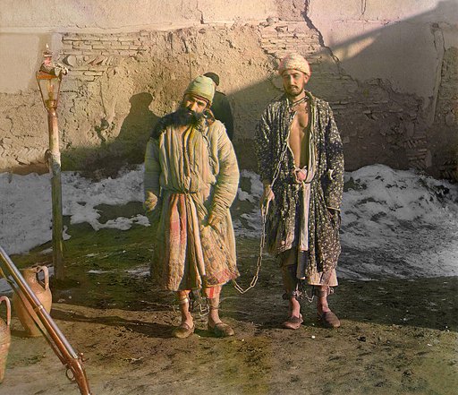 Two prisoners in shackles