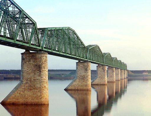 Trans-Siberian Railway metal truss bridge on stone piers, over the Kama River near Perm, Ural Mountains Region