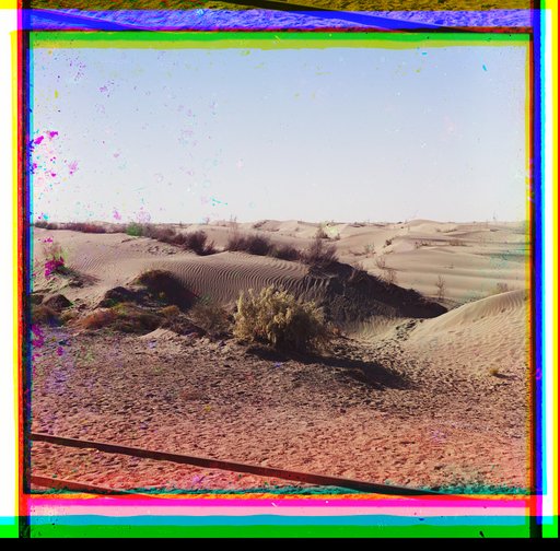 Railroad tracks through desert dunes