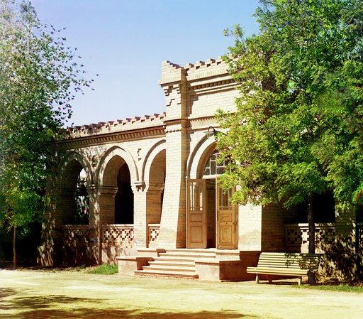 Brick building with arched entrance and arcade