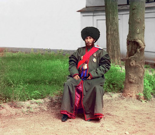 Isfandiyar, Khan of the Russian protectorate of Khorezm(Khiva), full-length portrait, seated outdoors